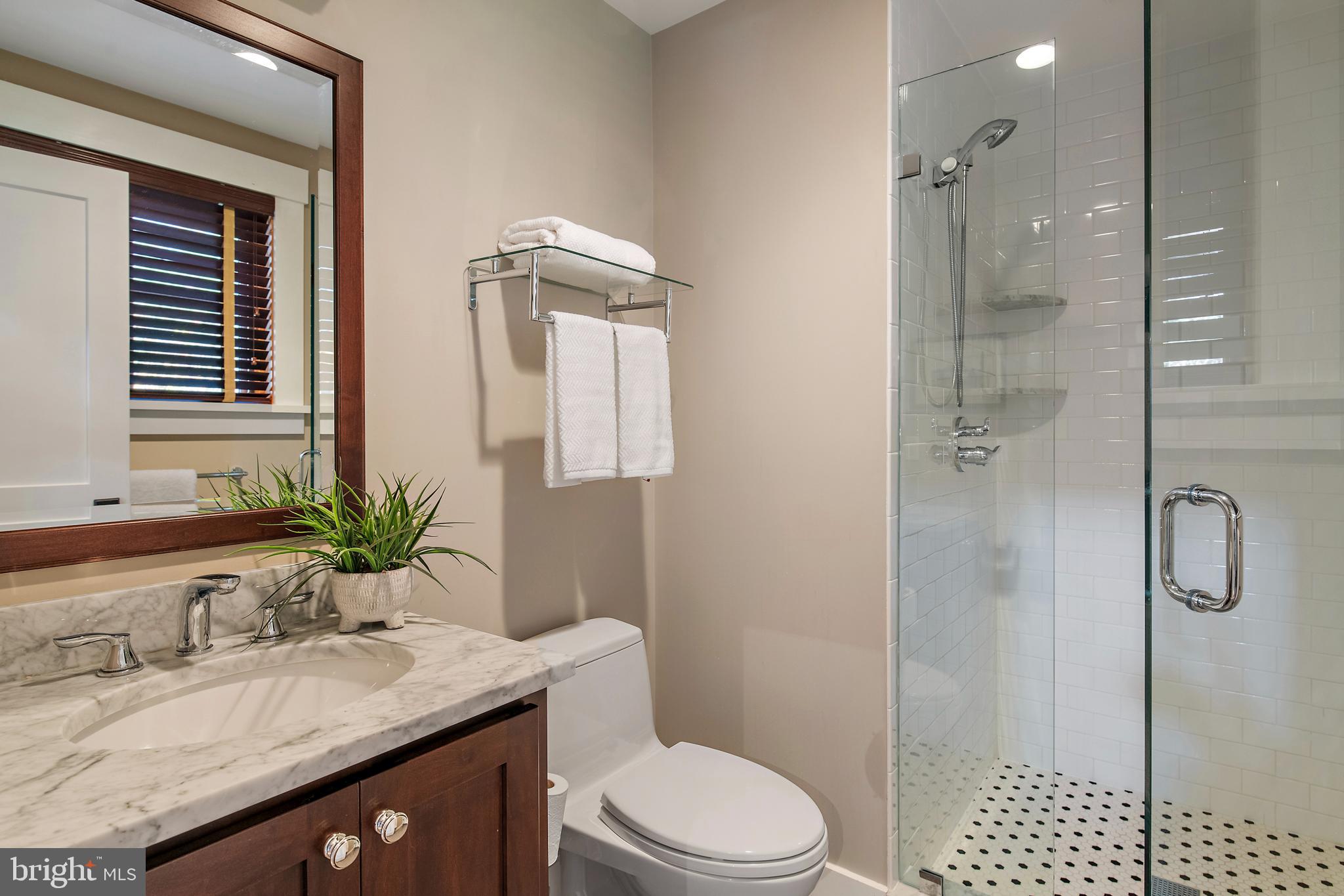397 Forelands Road Annapolis, MD 21401 - Photo 57 of 83 a bathroom with a granite countertop sink toilet and shower