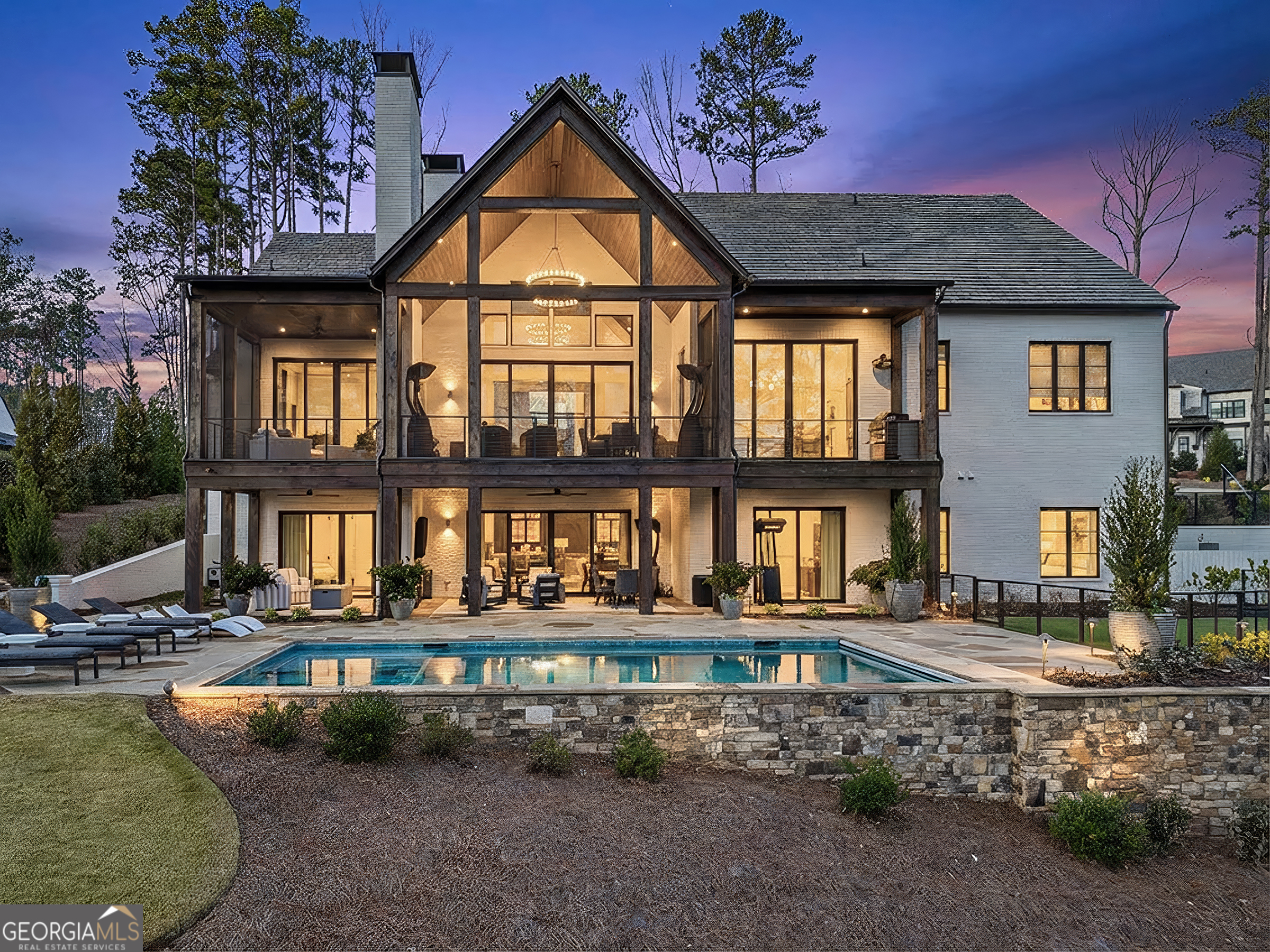 a front view of a house with porch yard and swimming pool