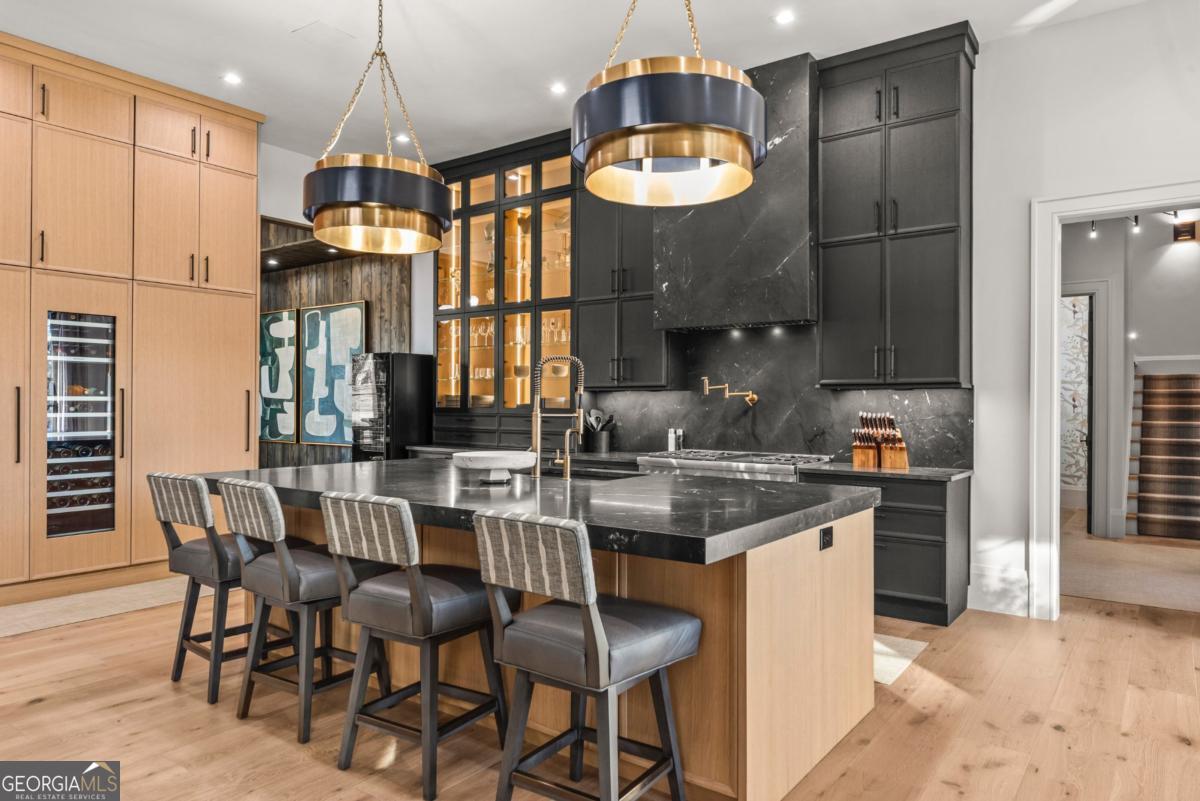 1131 Neary Ridge Greensboro, GA 30642 - Photo 13 of 72 a kitchen with cabinets and chairs