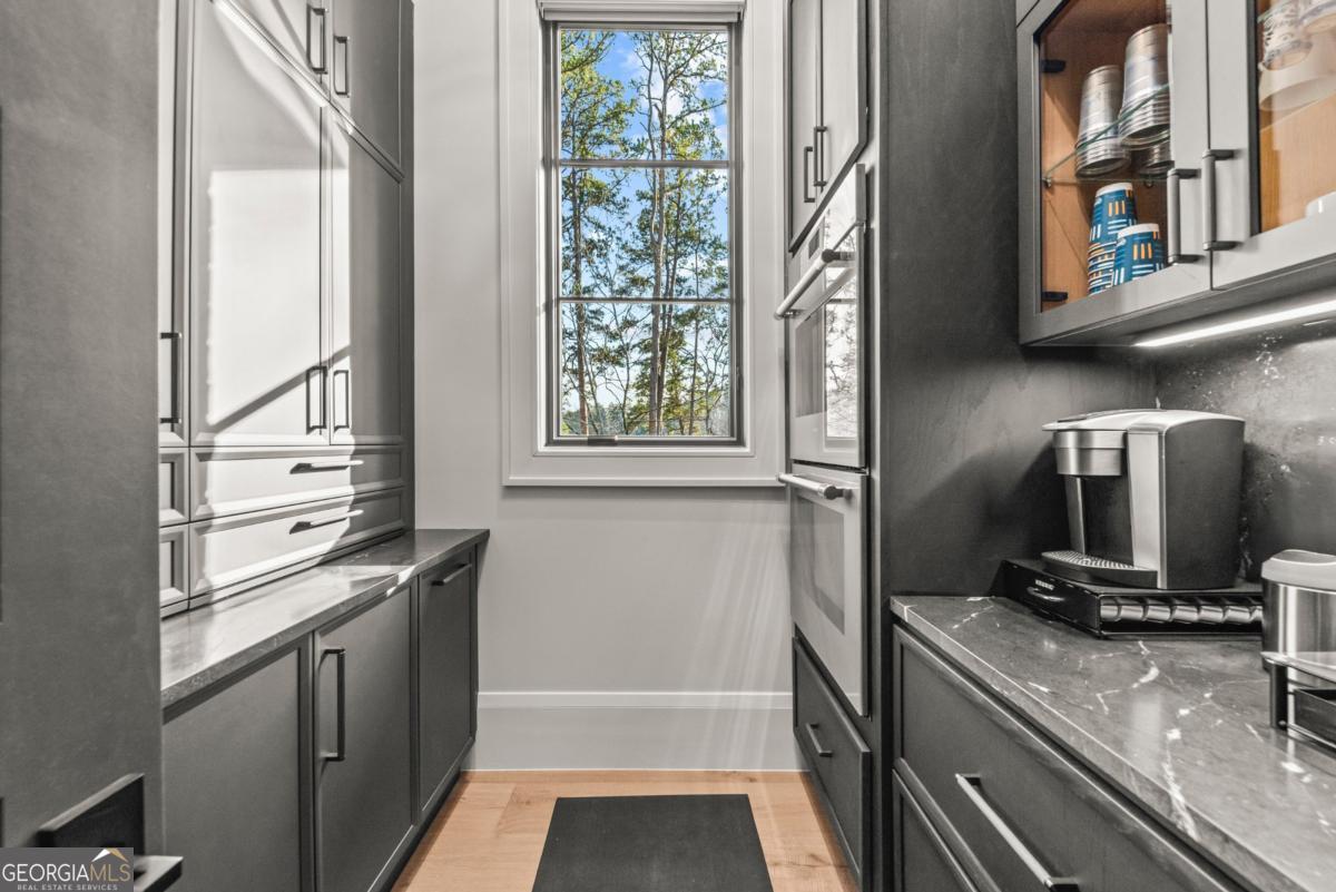 1131 Neary Ridge Greensboro, GA 30642 - Photo 17 of 72 a kitchen with stainless steel appliances granite countertop a refrigerator and a sink