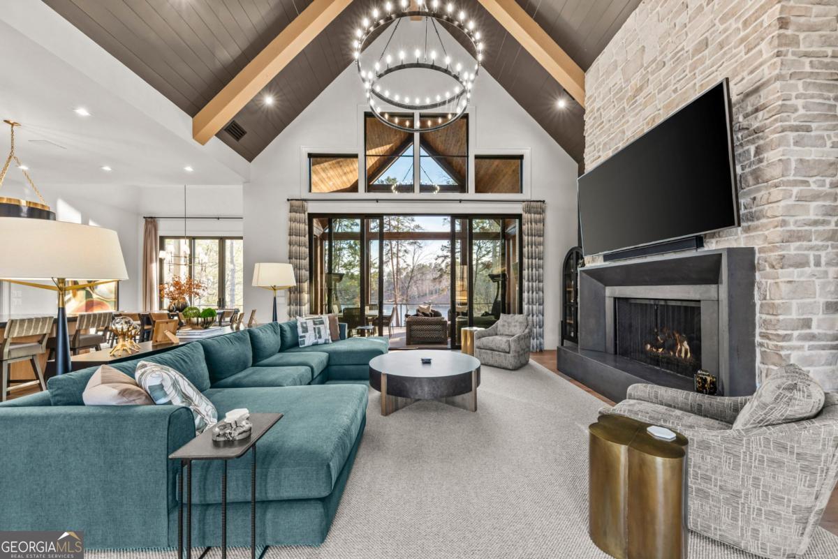 1131 Neary Ridge Greensboro, GA 30642 - Photo 20 of 72 a living room with furniture a large window and a fireplace