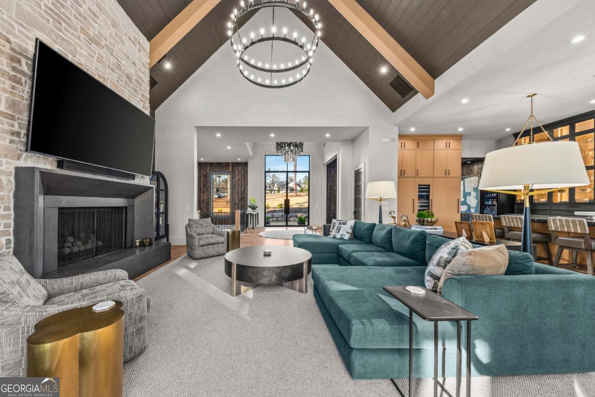 1131 Neary Ridge Greensboro, GA 30642 - Photo 21 of 72 a living room with fireplace furniture and a flat screen tv