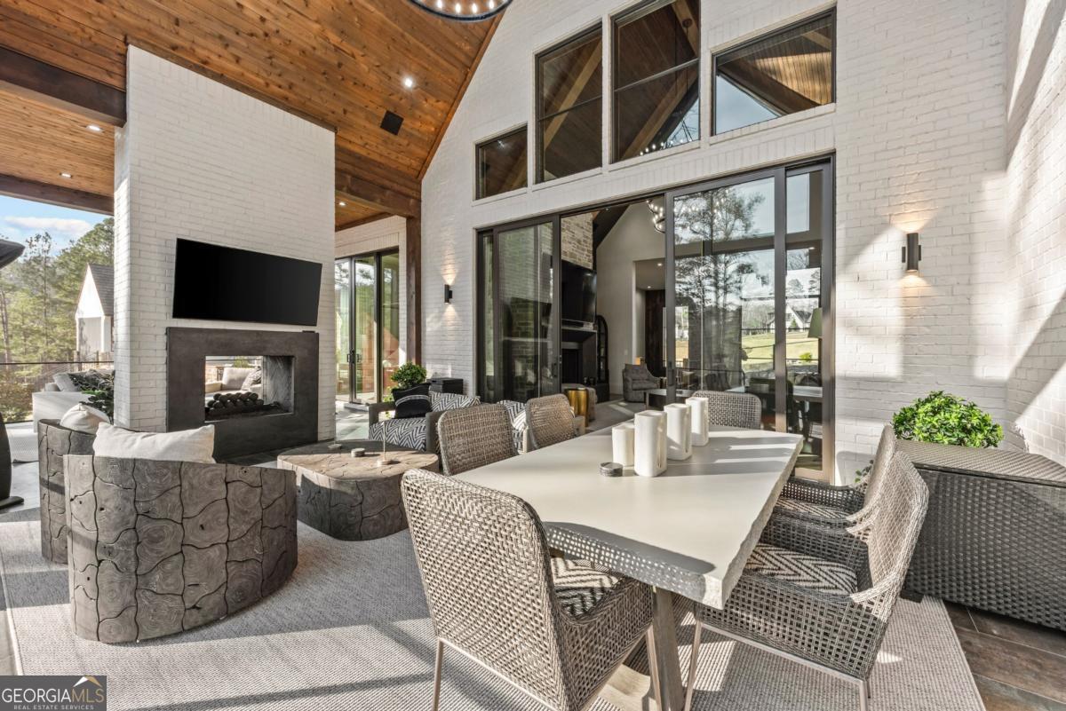 1131 Neary Ridge Greensboro, GA 30642 - Photo 26 of 72 a living room with fireplace furniture and a large window