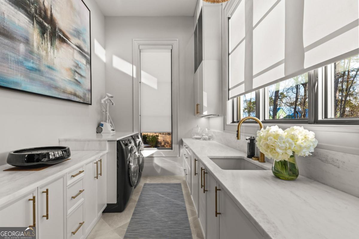 1131 Neary Ridge Greensboro, GA 30642 - Photo 27 of 72 a kitchen with stainless steel appliances a sink a stove and a window