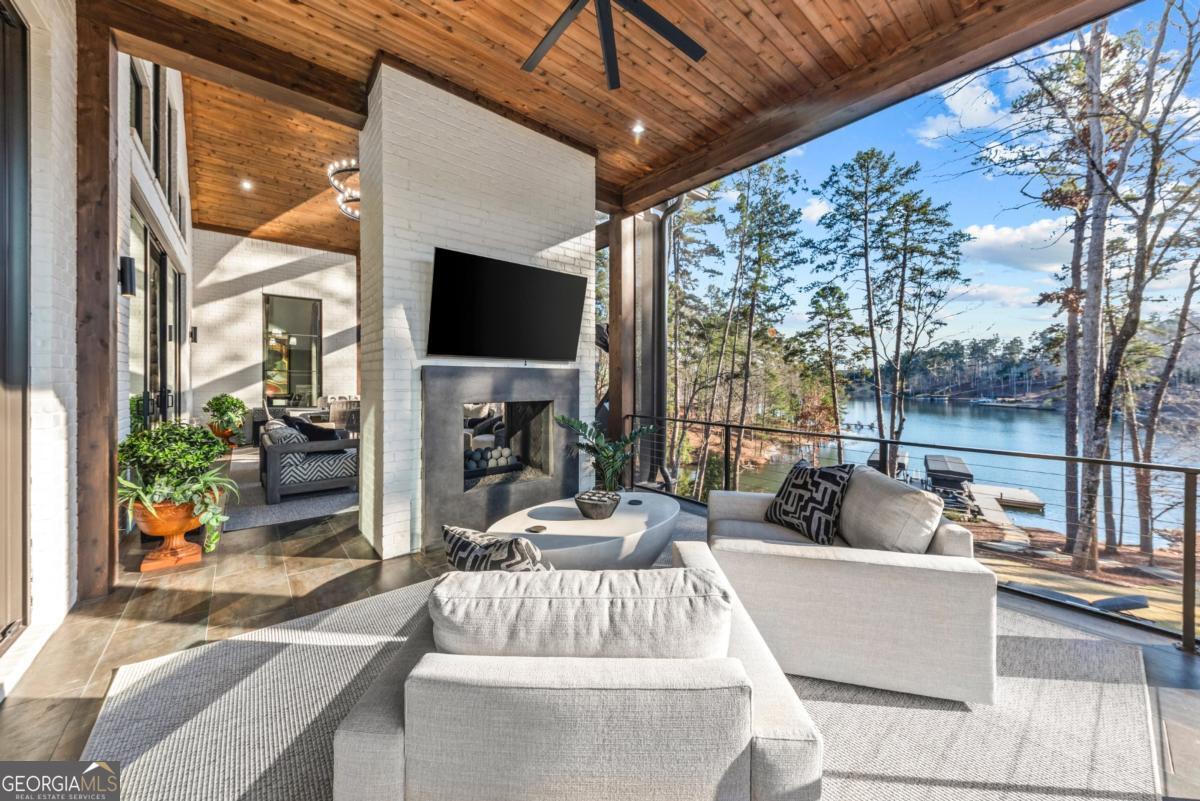 1131 Neary Ridge Greensboro, GA 30642 - Photo 35 of 72 a view of living room with patio furniture and a fireplace