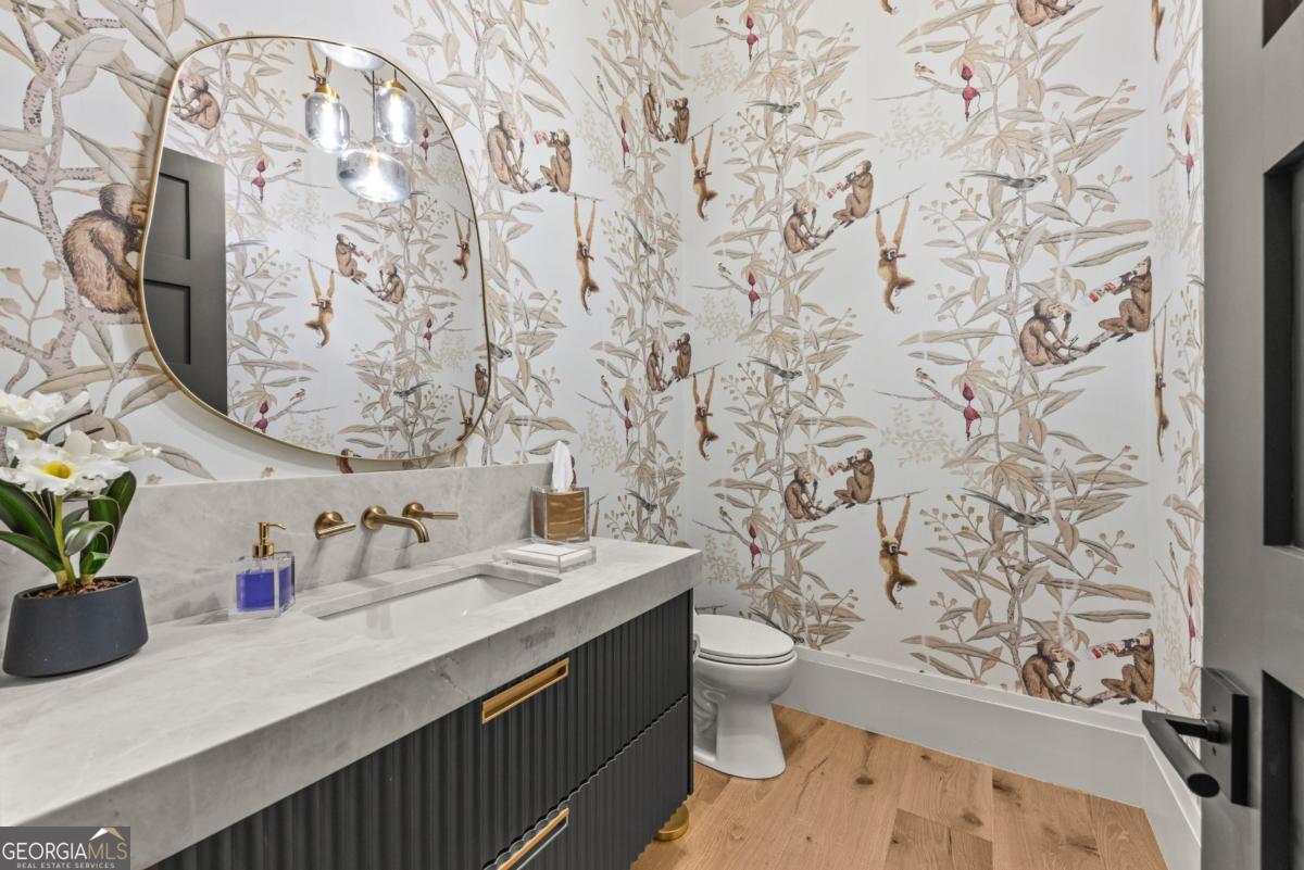 1131 Neary Ridge Greensboro, GA 30642 - Photo 38 of 72 a bathroom with a sink and a mirror