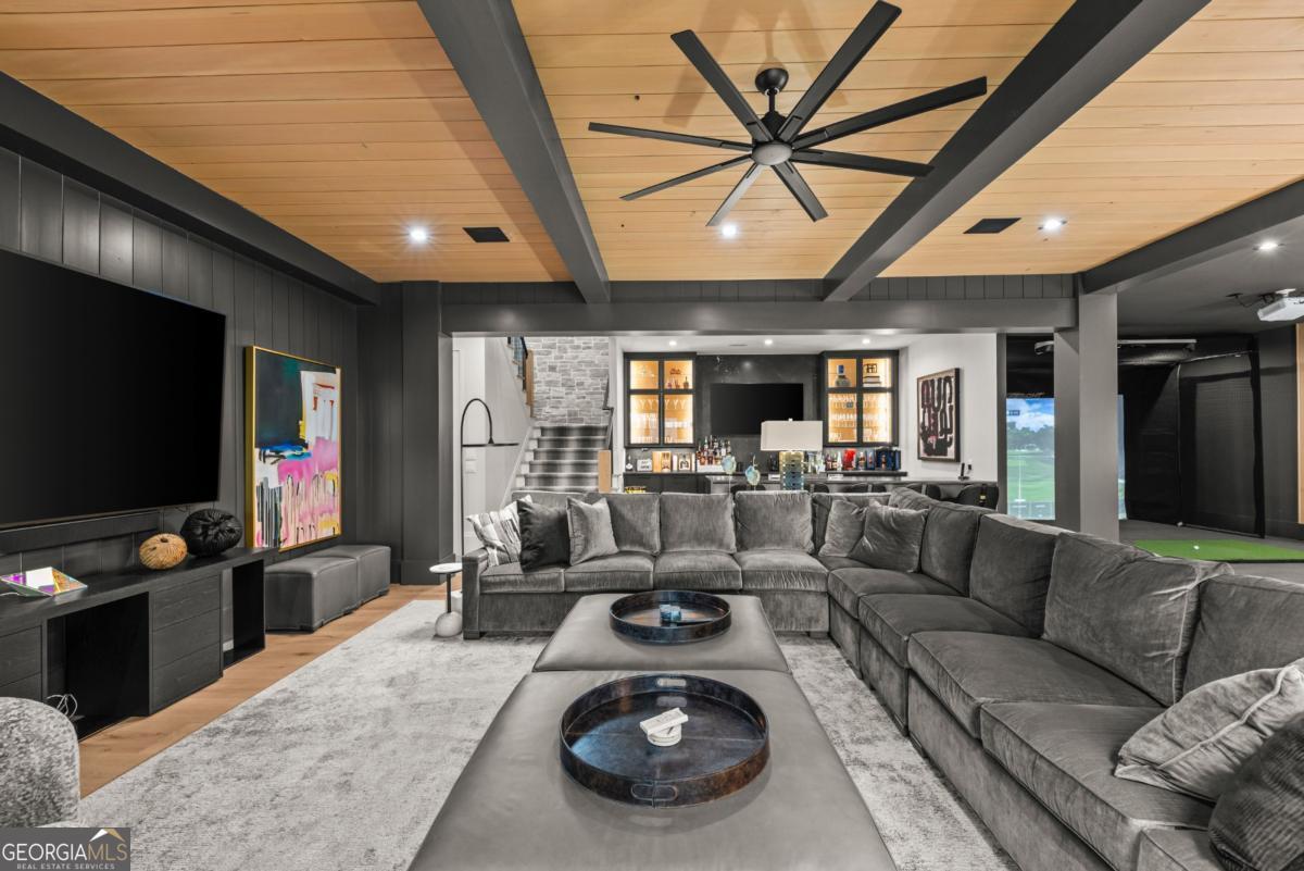 1131 Neary Ridge Greensboro, GA 30642 - Photo 44 of 72 a living room with furniture and a flat screen tv