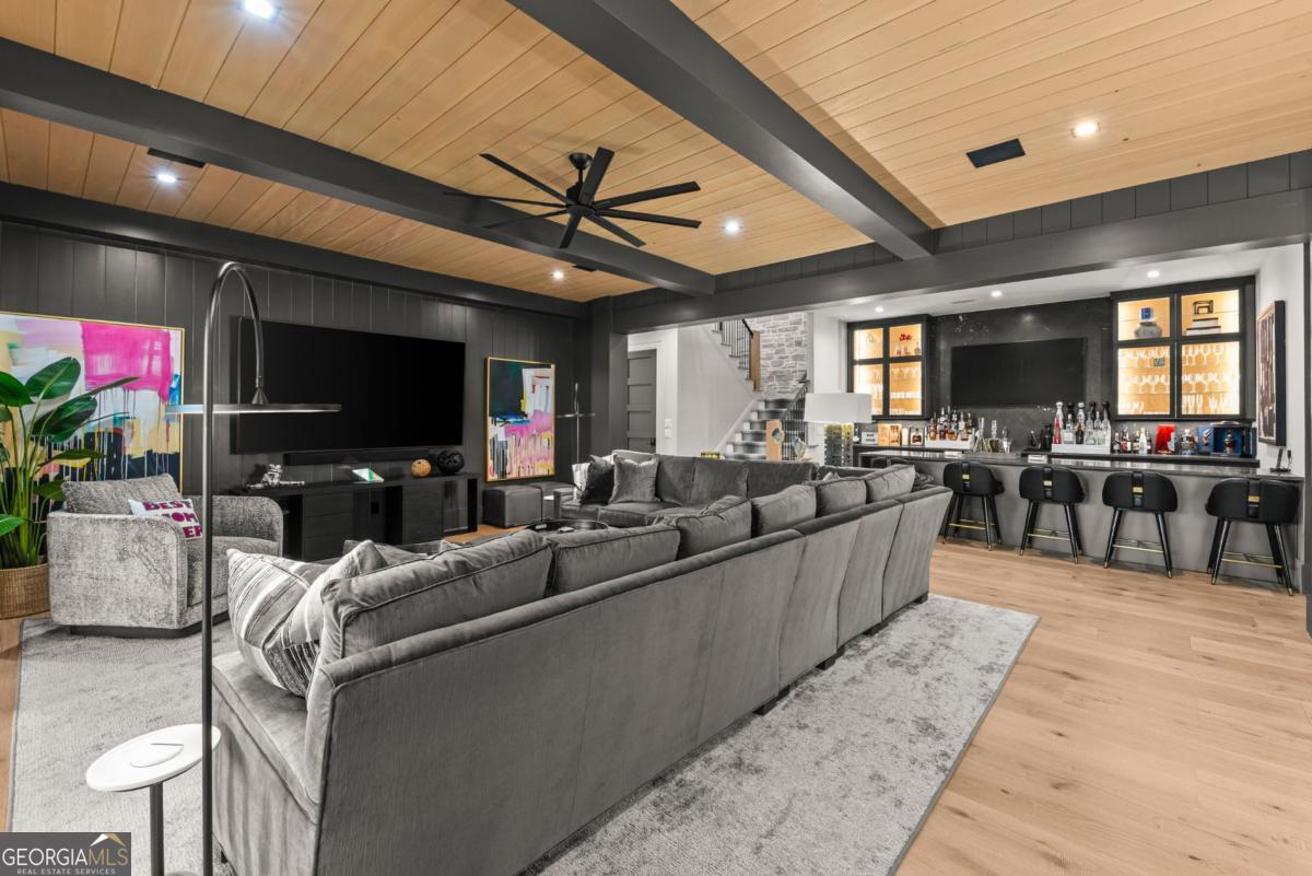 1131 Neary Ridge Greensboro, GA 30642 - Photo 46 of 72 a living room with furniture and a flat screen tv