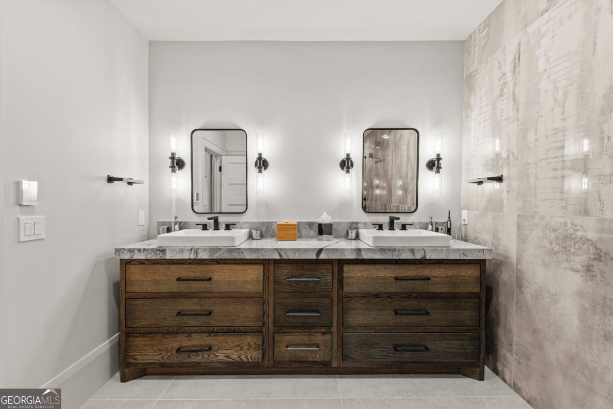 1131 Neary Ridge Greensboro, GA 30642 - Photo 62 of 72 a bathroom with a granite countertop sink and a mirror