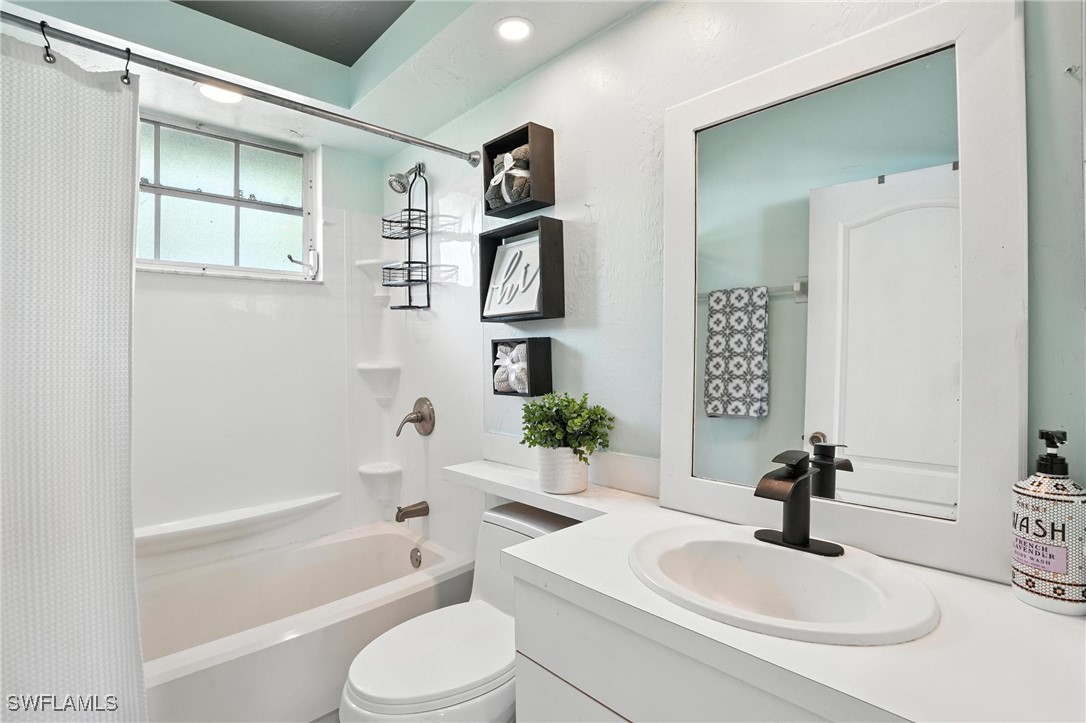 5242 17th Place Southwest Naples, FL 34116 - Photo 15 of 19 a bathroom with a sink toilet and shower