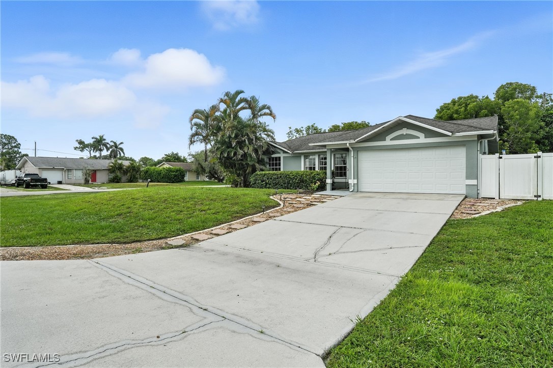 5242 17th Place Southwest Naples, FL 34116 - Photo 18 of 19 a view of house with a garden