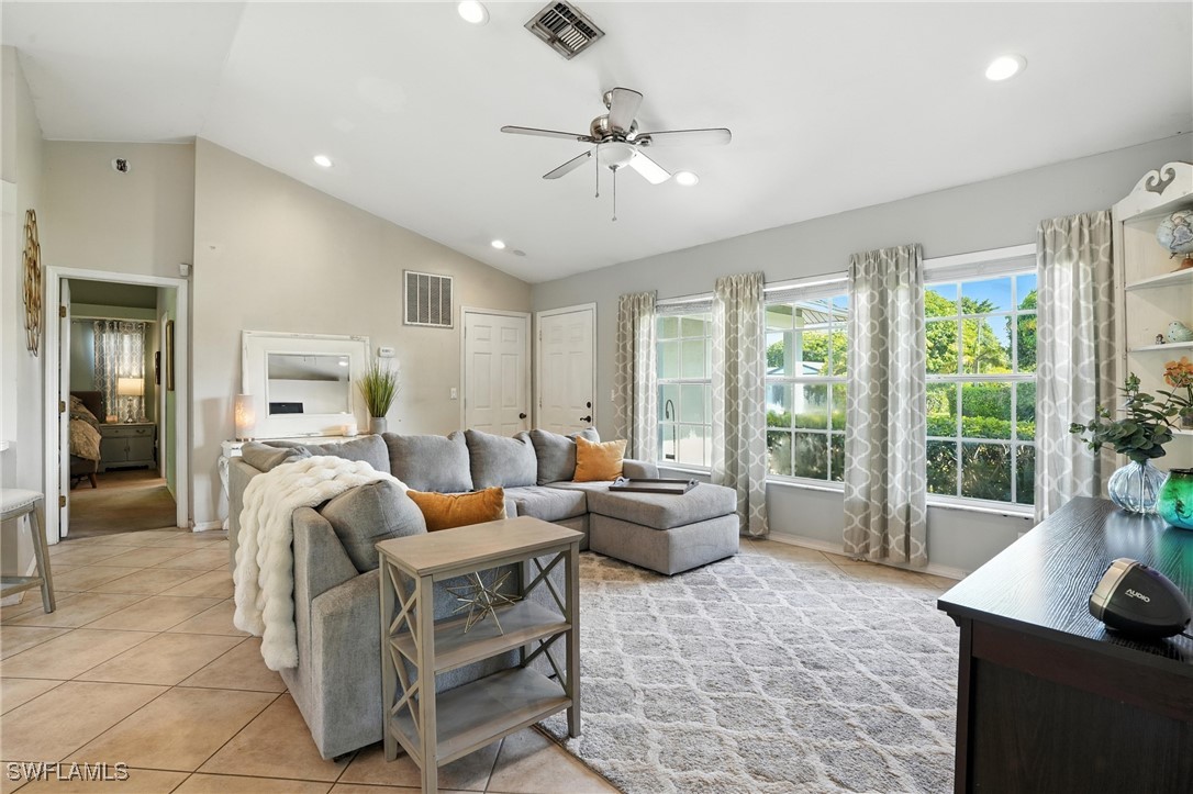 5242 17th Place Southwest Naples, FL 34116 - Photo 4 of 19 a living room with furniture and a large window