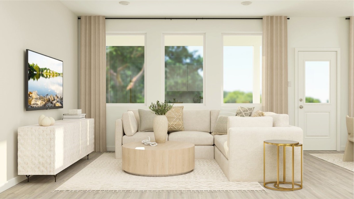 7915 Evening Emerald Drive Rosharon, TX 77583 - Photo 12 of 17 a living room with furniture and a large window