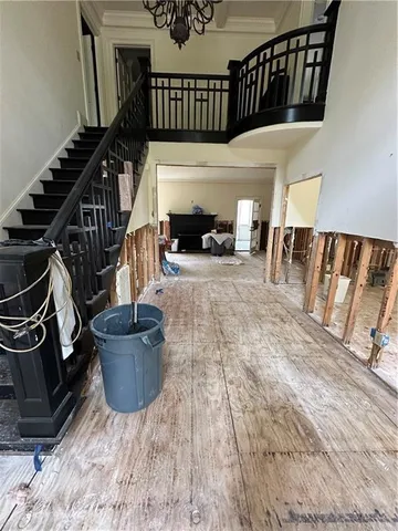 a view of an entryway with wooden floor