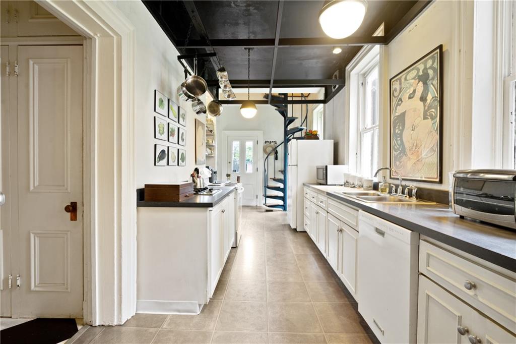 4841 Ellsworth Avenue Pittsburgh, PA 15213 - Photo 11 of 25 a large white kitchen with a large window