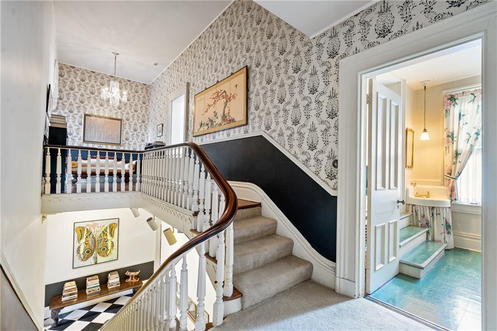 4841 Ellsworth Avenue Pittsburgh, PA 15213 - Photo 14 of 25 a view of a hallway with wooden floor and staircase