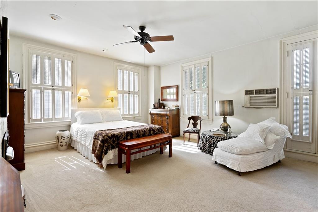 4841 Ellsworth Avenue Pittsburgh, PA 15213 - Photo 17 of 25 a spacious bedroom with a bed and large windows