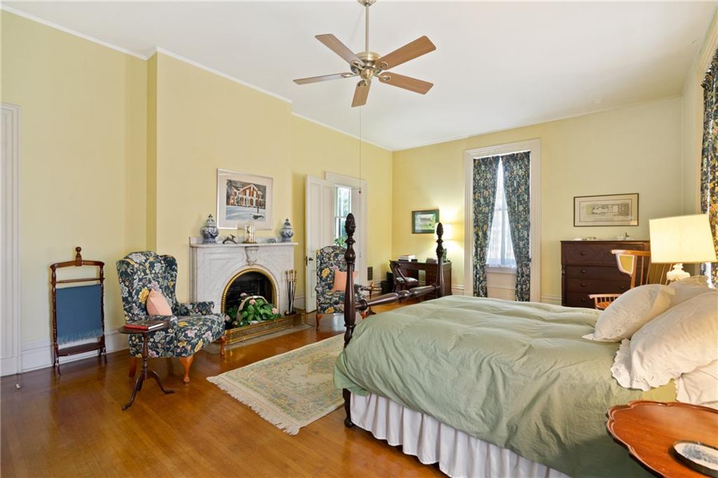 4841 Ellsworth Avenue Pittsburgh, PA 15213 - Photo 18 of 25 a bedroom with furniture and a fireplace