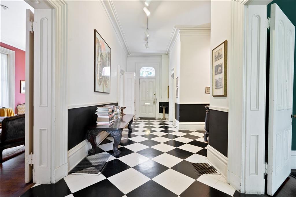 4841 Ellsworth Avenue Pittsburgh, PA 15213 - Photo 4 of 25 a living room with a black white checkered floor with couches and a coffee table