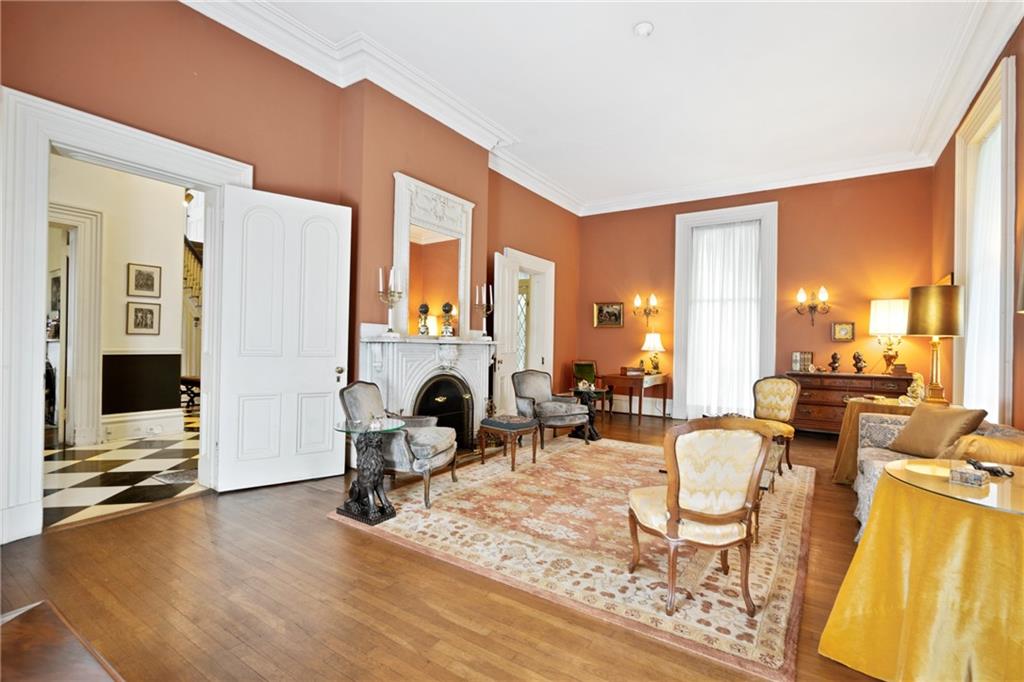 4841 Ellsworth Avenue Pittsburgh, PA 15213 - Photo 5 of 25 a living room with furniture a fireplace and flat screen tv