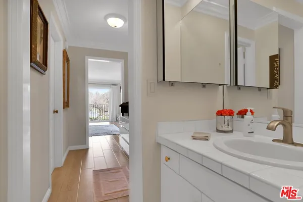 a kitchen with a sink and a refrigerator