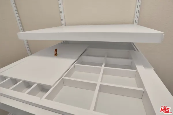 a view of an empty walk in closet