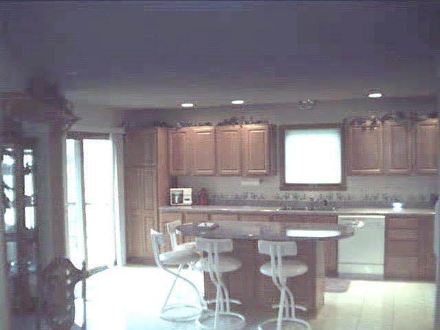 1719 Baintree Road Lake Summerset, IL 61019 - Photo 3 of 5 a kitchen with kitchen island granite countertop a sink and cabinets