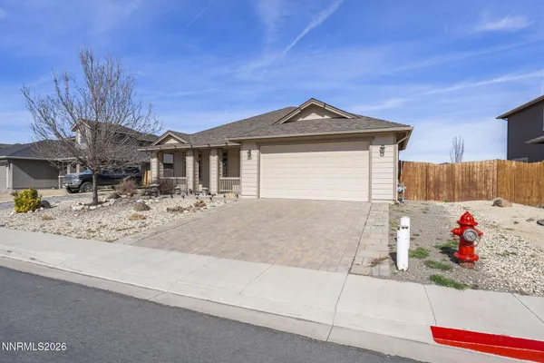 a front view of a house with a outdoor space