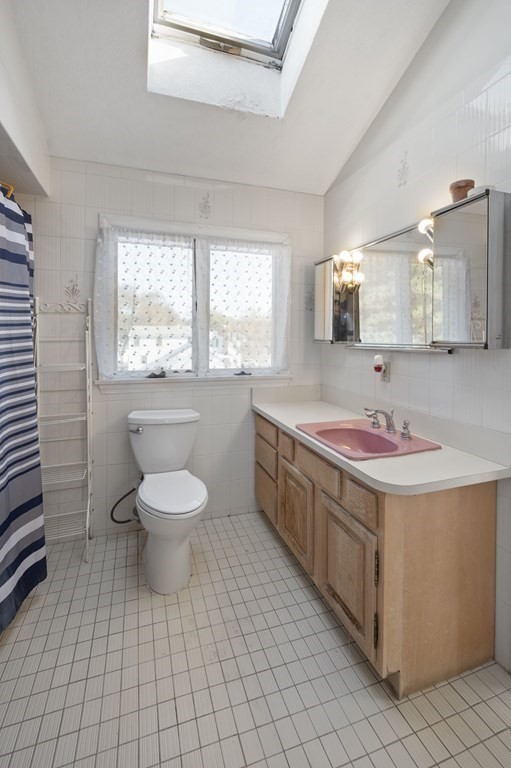 59 Proctor Circle Peabody, MA 01960 - Photo 17 of 32 a bathroom with a sink a toilet and mirror