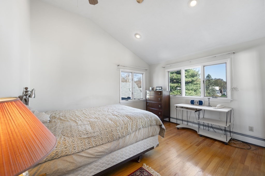 59 Proctor Circle Peabody, MA 01960 - Photo 18 of 32 a bedroom with a bed and a desk