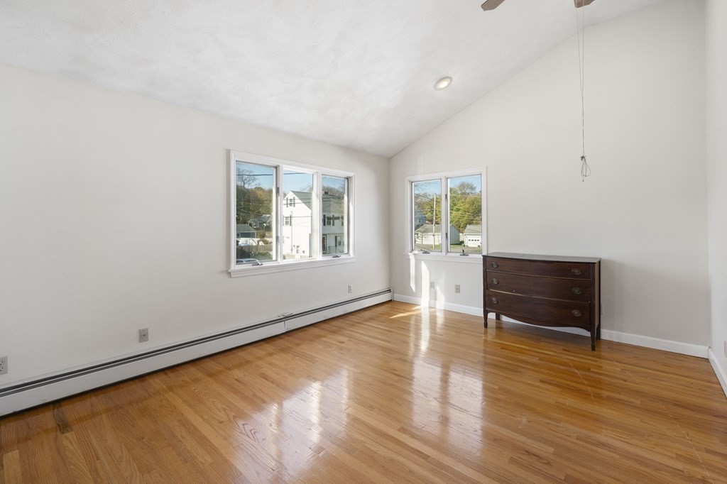 59 Proctor Circle Peabody, MA 01960 - Photo 20 of 32 a view of an empty room with wooden floor and a window