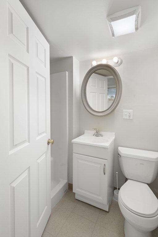 59 Proctor Circle Peabody, MA 01960 - Photo 28 of 32 a bathroom with a toilet a sink and a mirror