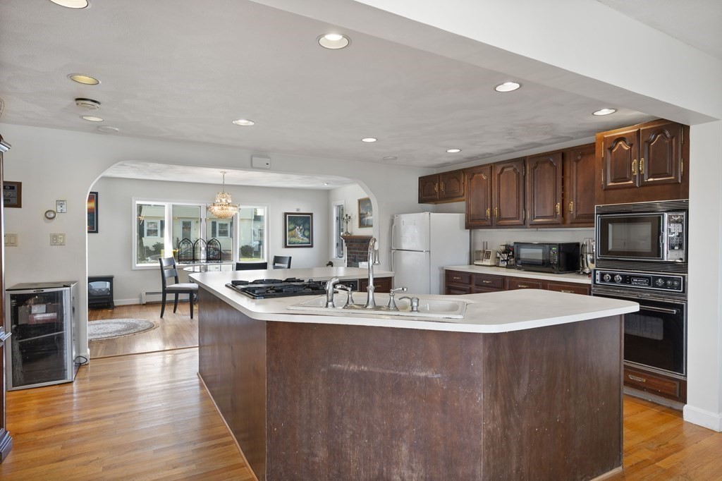 59 Proctor Circle Peabody, MA 01960 - Photo 3 of 32 a large kitchen with stainless steel appliances granite countertop a stove a sink a oven and a refrigerator
