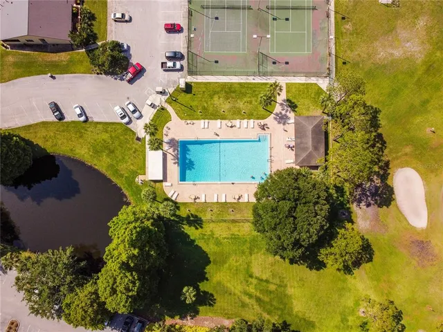 an aerial view of a house with a swimming pool
