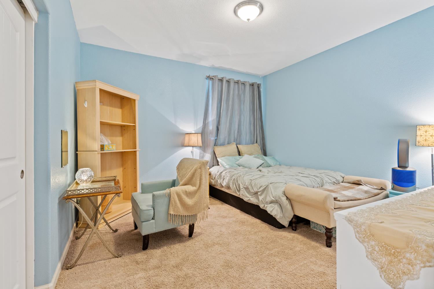 2011 Roy Ranch Way Plumas Lake, CA 95961 - Photo 21 of 49 a bedroom with a bed and chair
