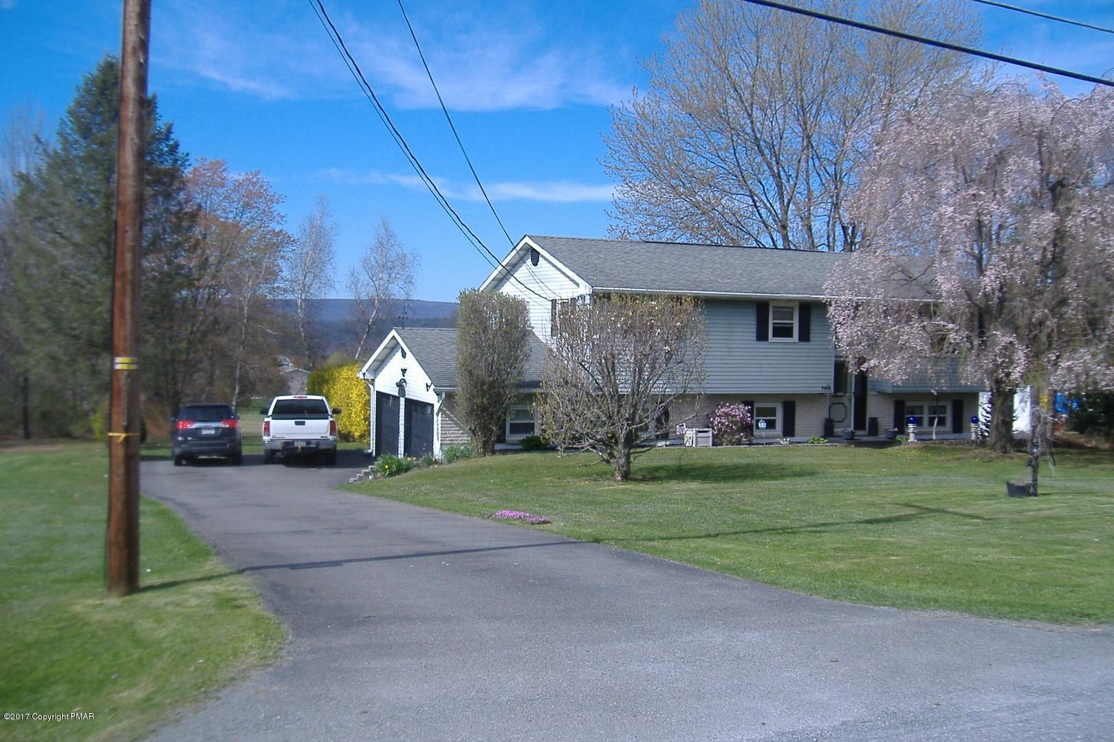 743 Carney Road Kunkletown, PA 18058 - Photo 1 of 26 a front view of a house with a yard and garage