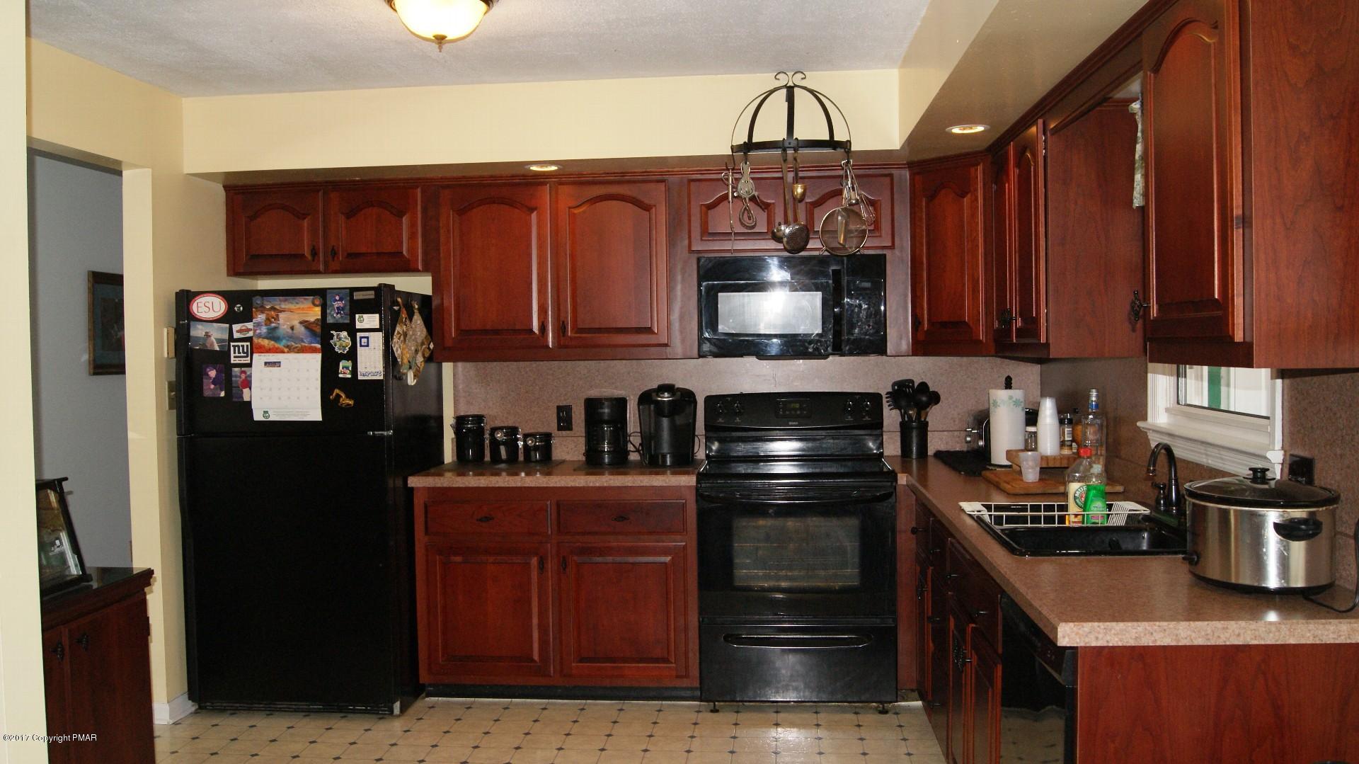 743 Carney Road Kunkletown, PA 18058 - Photo 3 of 26 a kitchen with stainless steel appliances granite countertop a refrigerator and a stove top oven