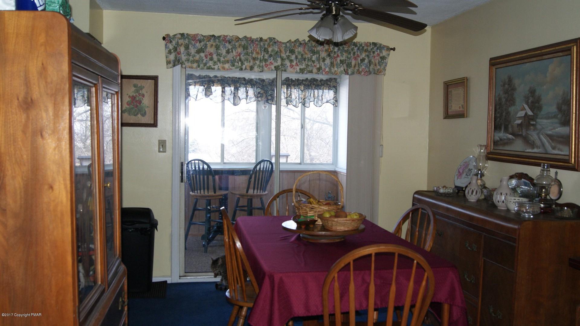 743 Carney Road Kunkletown, PA 18058 - Photo 7 of 26 a view of a dining room with furniture window and wooden floor