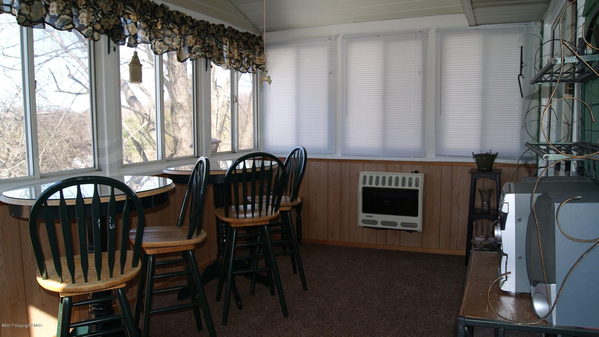 743 Carney Road Kunkletown, PA 18058 - Photo 8 of 26 a view of a dining room with furniture window and outside view