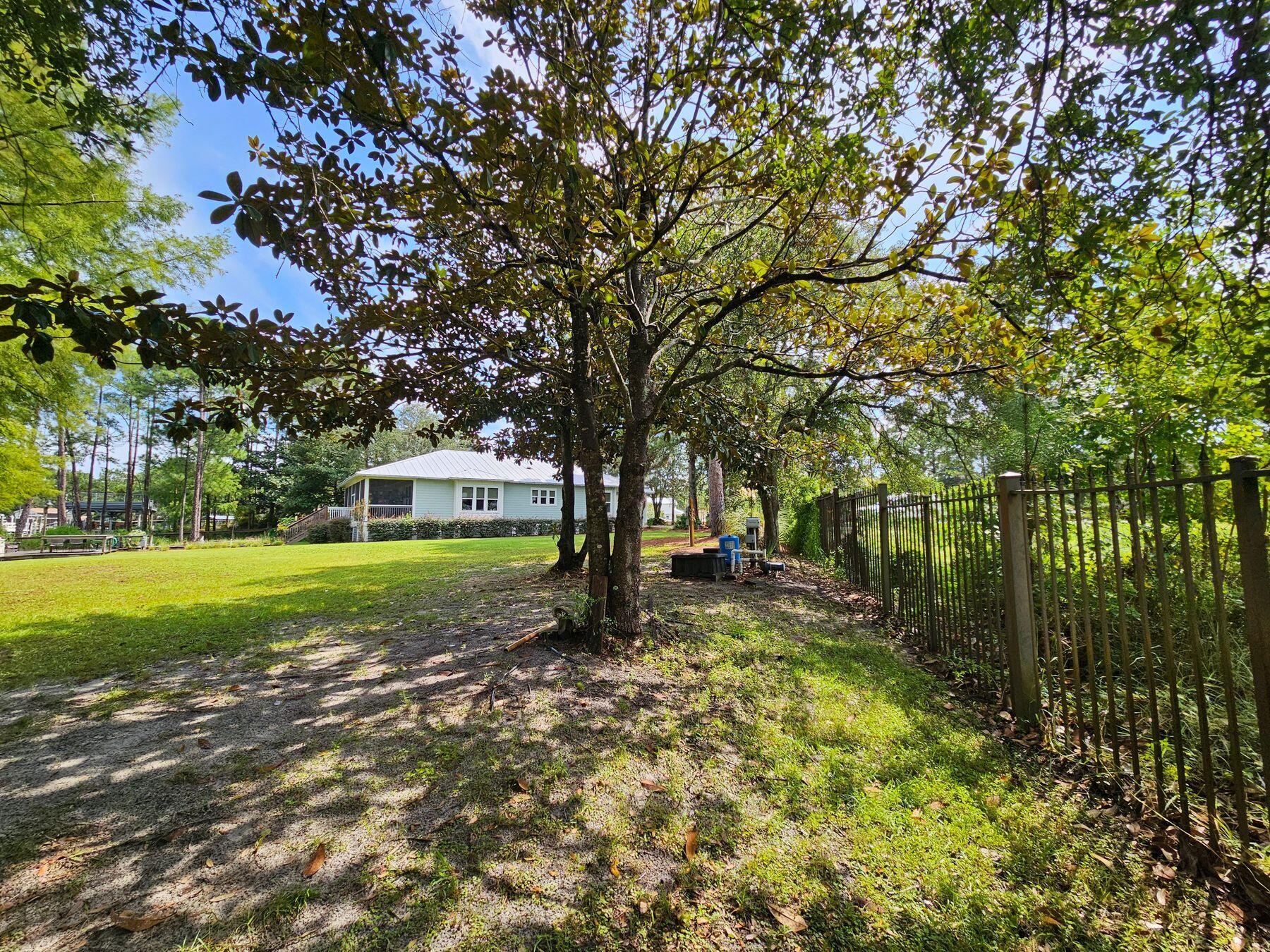1196 Mack Bayou Road Santa Rosa Beach, FL 32459 - Photo 18 of 19 a view of a house with a yard