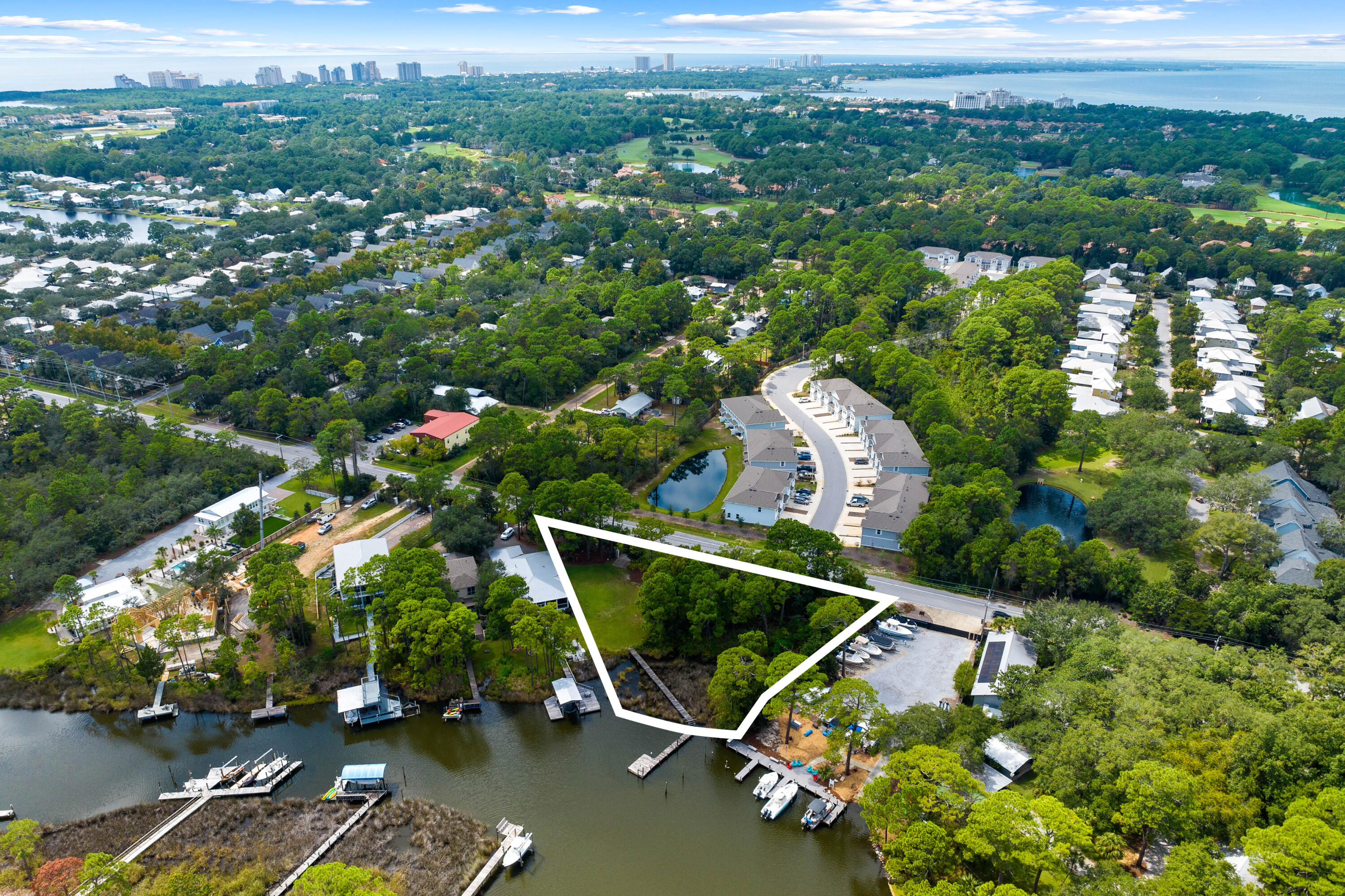 1196 Mack Bayou Road Santa Rosa Beach, FL 32459 - Photo 3 of 19 an aerial view of a house with a garden