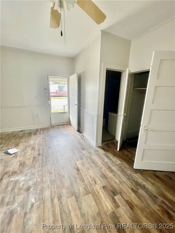 401 South Clinton Avenue, Unit B Dunn, NC 28334 - Photo 2 of 8 a view of empty room with wooden floor