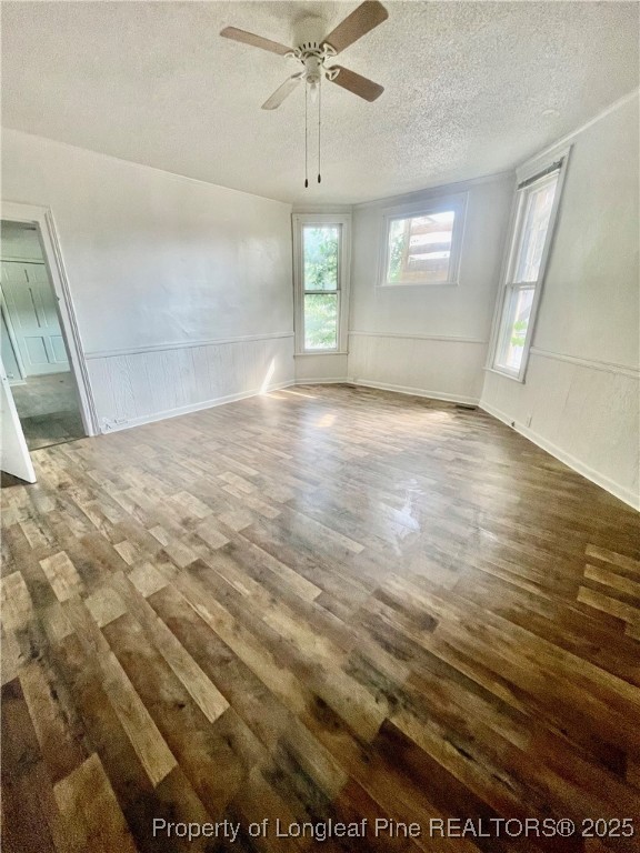 401 South Clinton Avenue, Unit B Dunn, NC 28334 - Photo 7 of 8 wooden floor in an empty room with a window