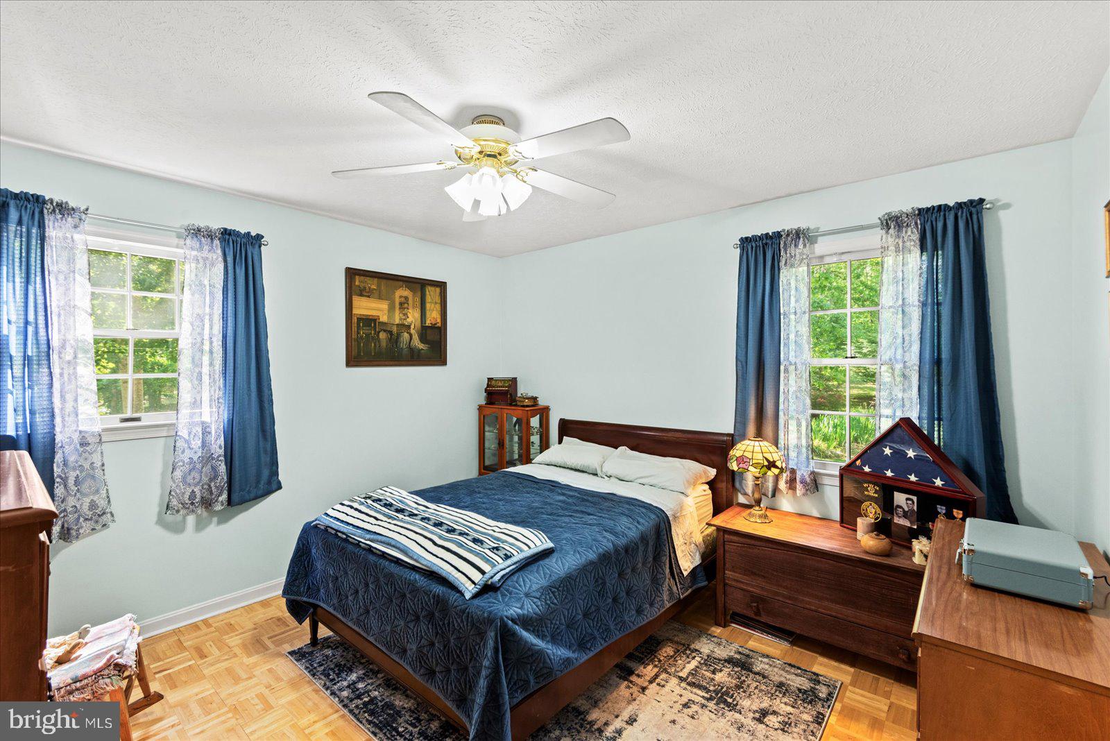 804 Buggy Lane Rochelle, VA 22738 - Photo 22 of 50 a bedroom with a bed and a chandelier