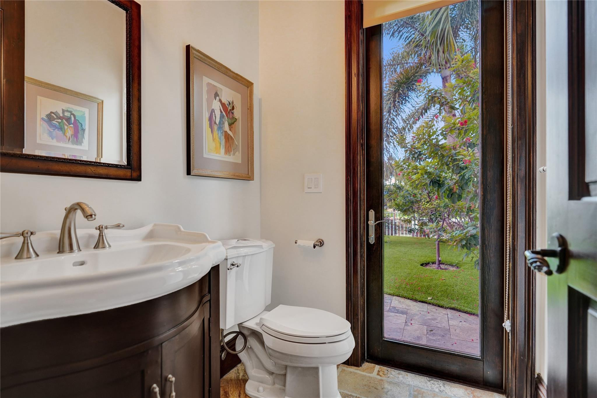 4930 Northeast 27th Terrace Lighthouse Point, FL 33064 - Photo 11 of 51 a bathroom with a sink and a mirror