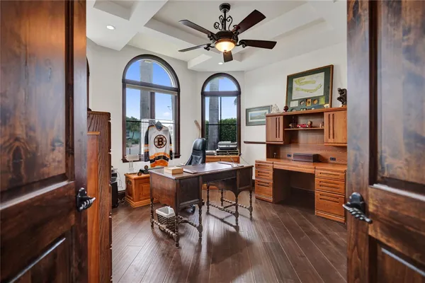 a living room with furniture a large window and a fireplace