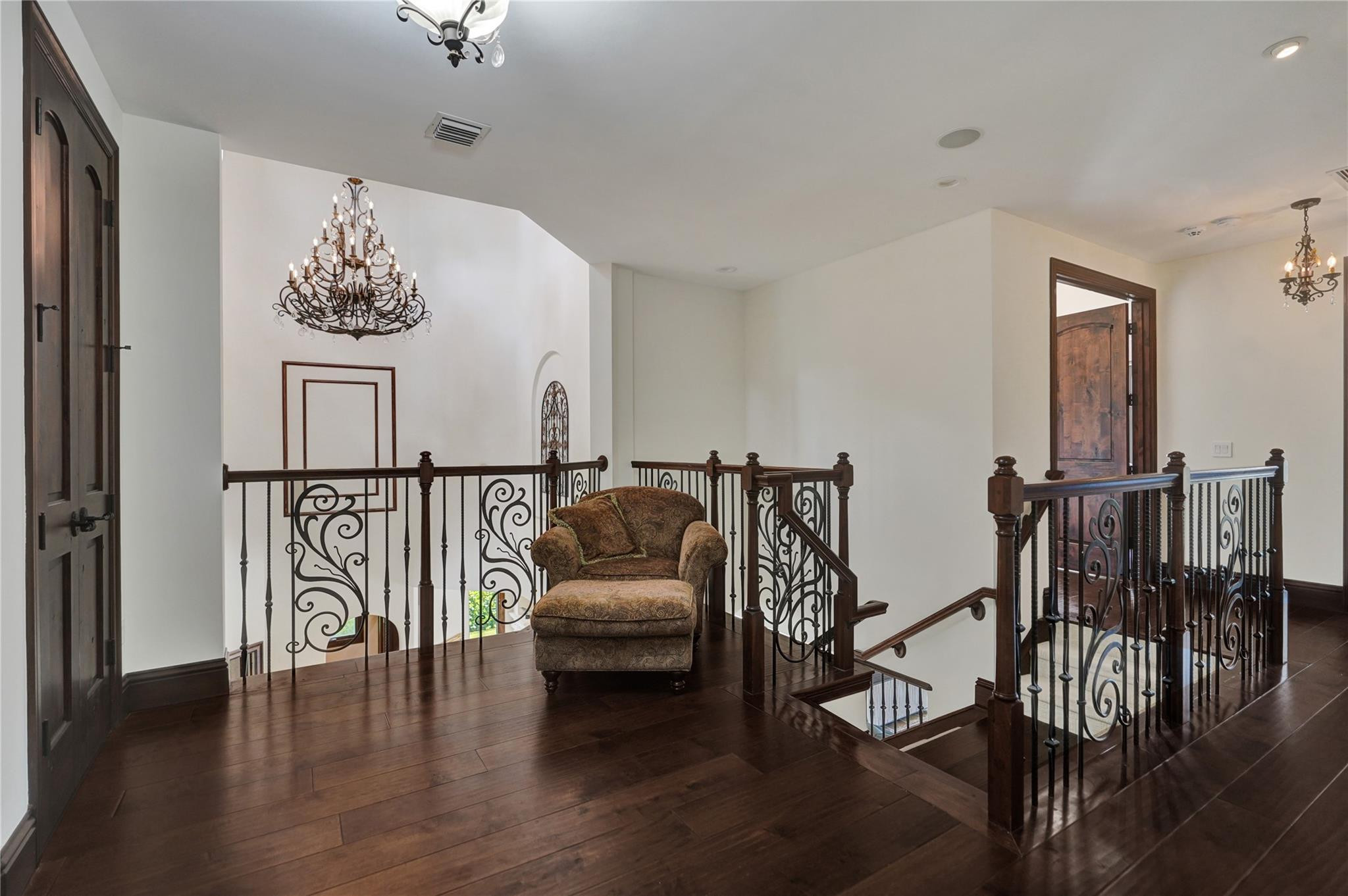 4930 Northeast 27th Terrace Lighthouse Point, FL 33064 - Photo 18 of 51 a hallway with wooden floor fireplace and windows