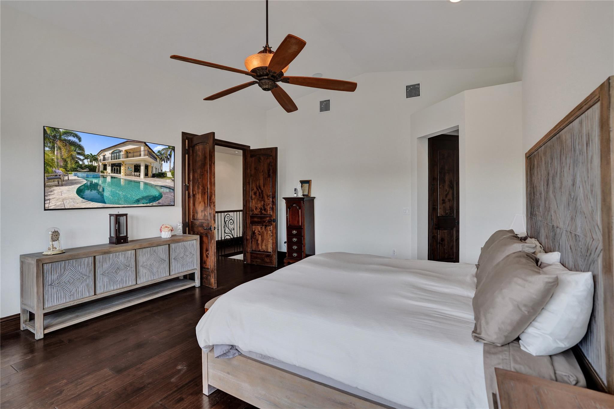 4930 Northeast 27th Terrace Lighthouse Point, FL 33064 - Photo 23 of 51 a bedroom with a bed and a flat screen tv