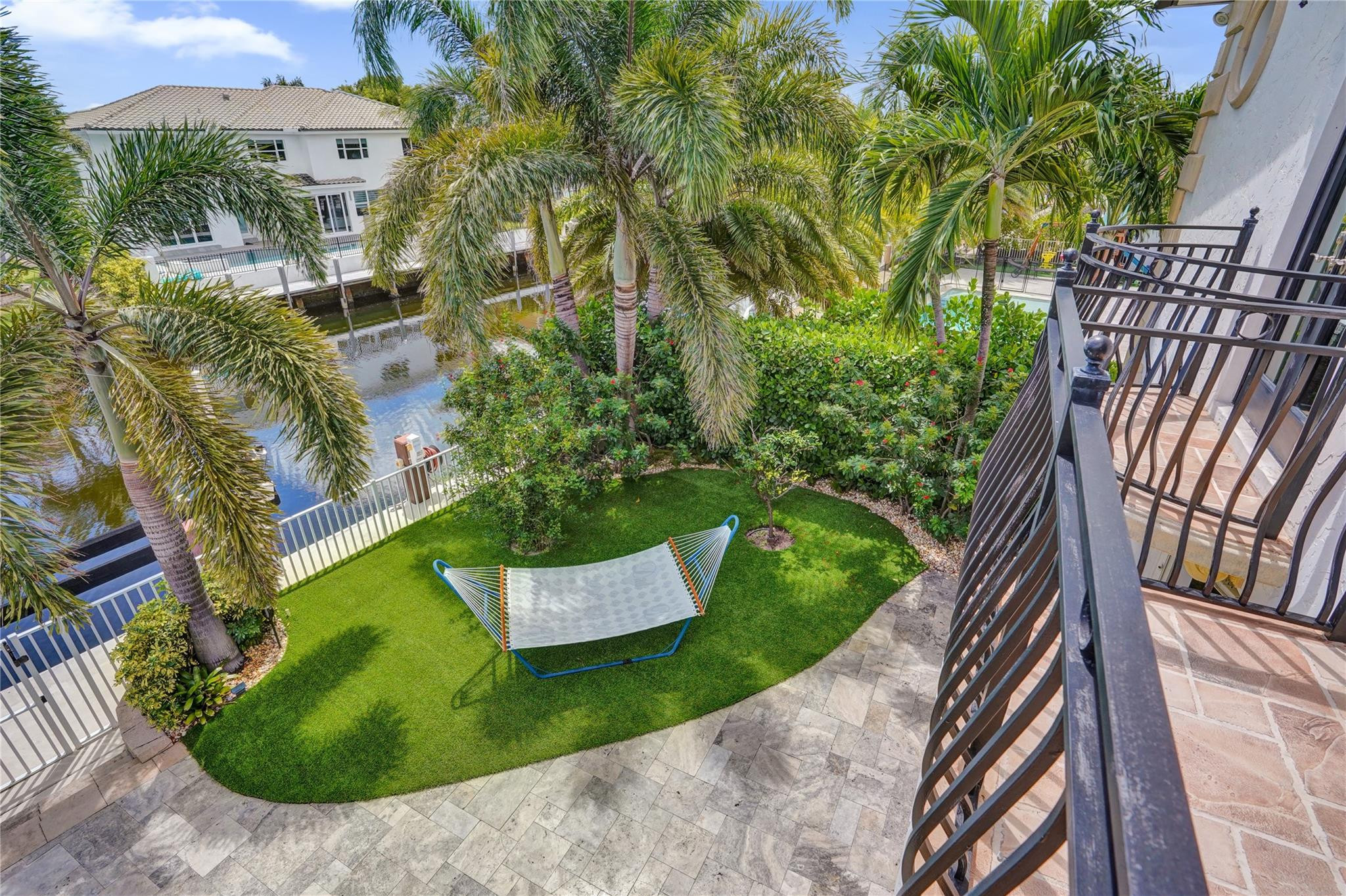 4930 Northeast 27th Terrace Lighthouse Point, FL 33064 - Photo 25 of 51 a view of a backyard with plants