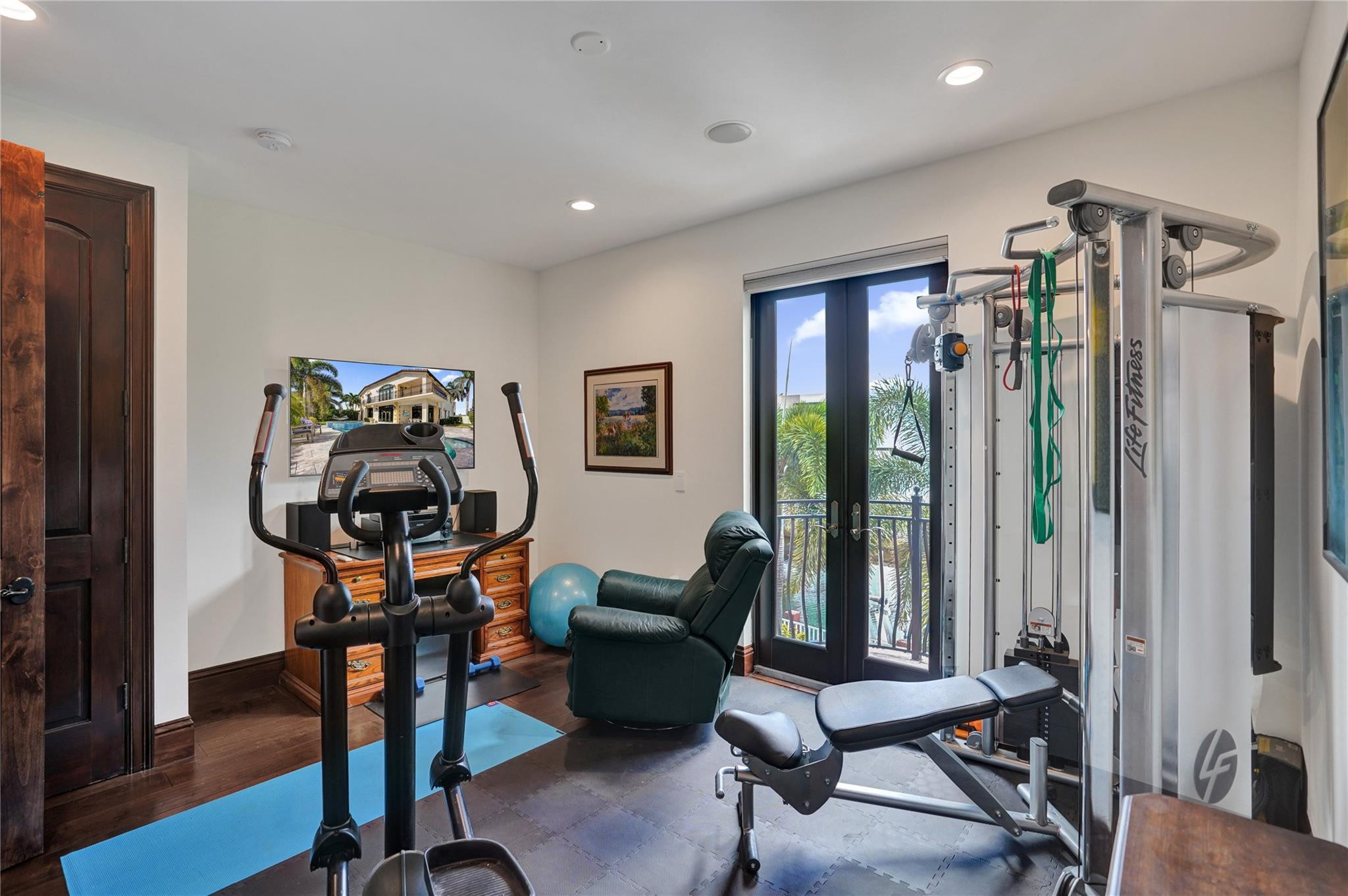 4930 Northeast 27th Terrace Lighthouse Point, FL 33064 - Photo 29 of 51 a view of a room with gym equipment